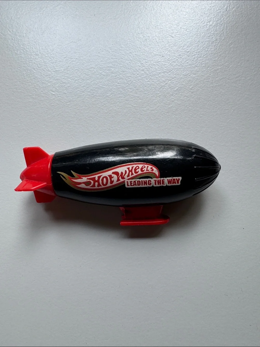 Black & Red Blimp Toy - Leading The Way